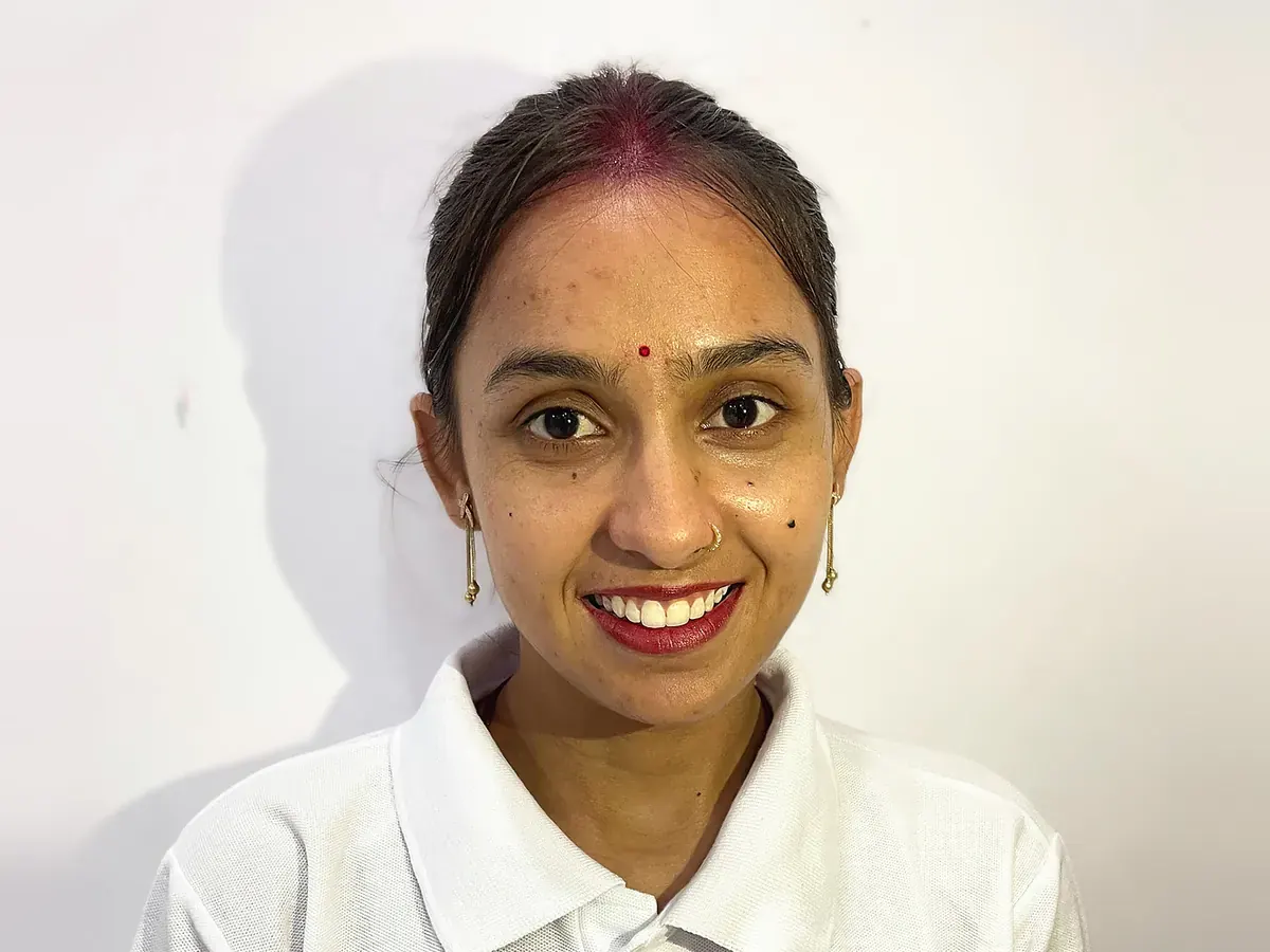Latika, online yoga instructor, smiling